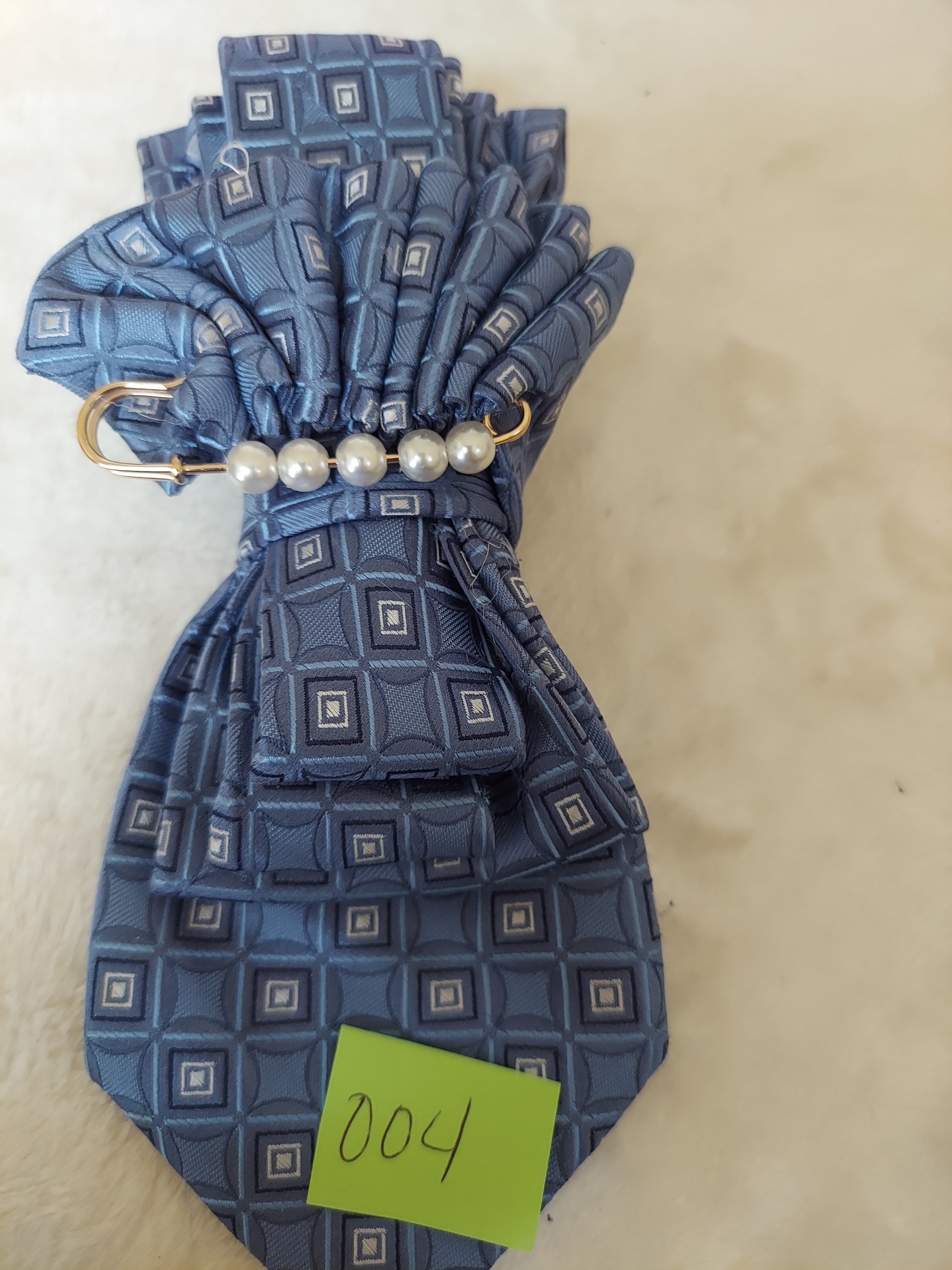 Handcrafted necktie jewelry piece