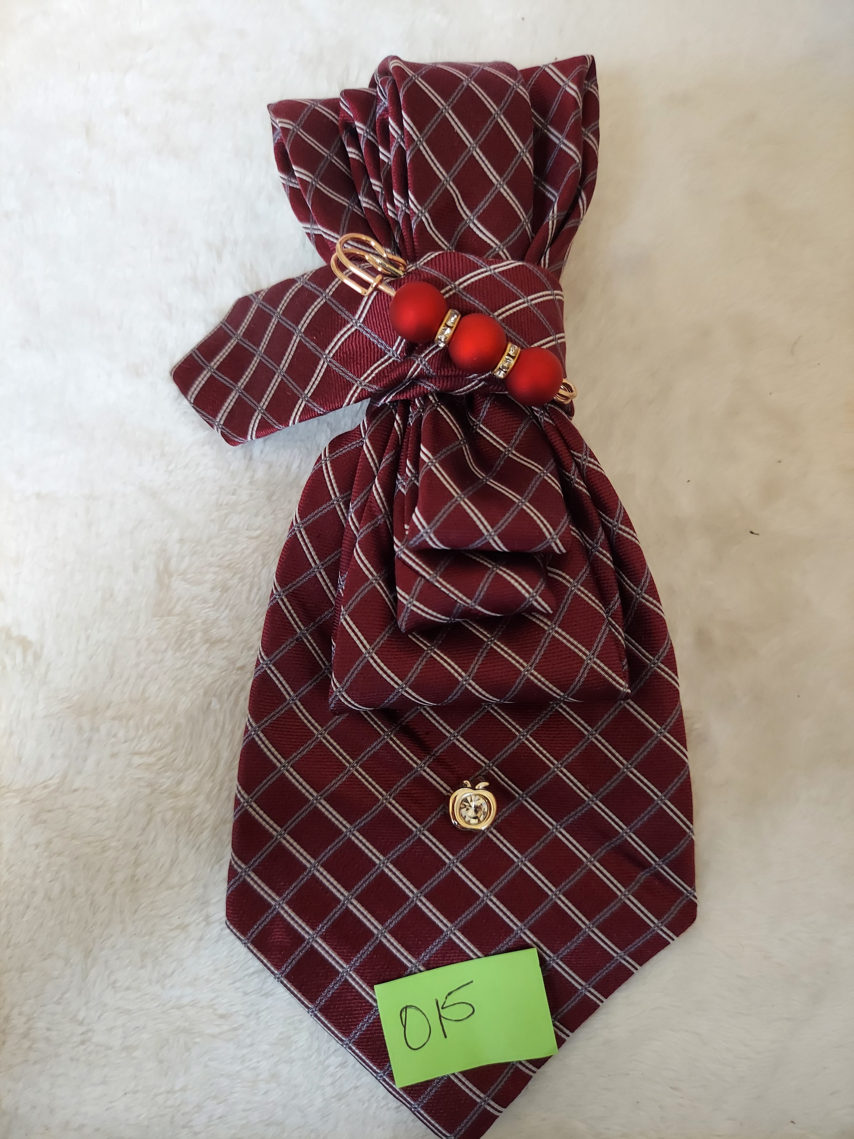 Burgundy plaid necktie headband with red ornament accents