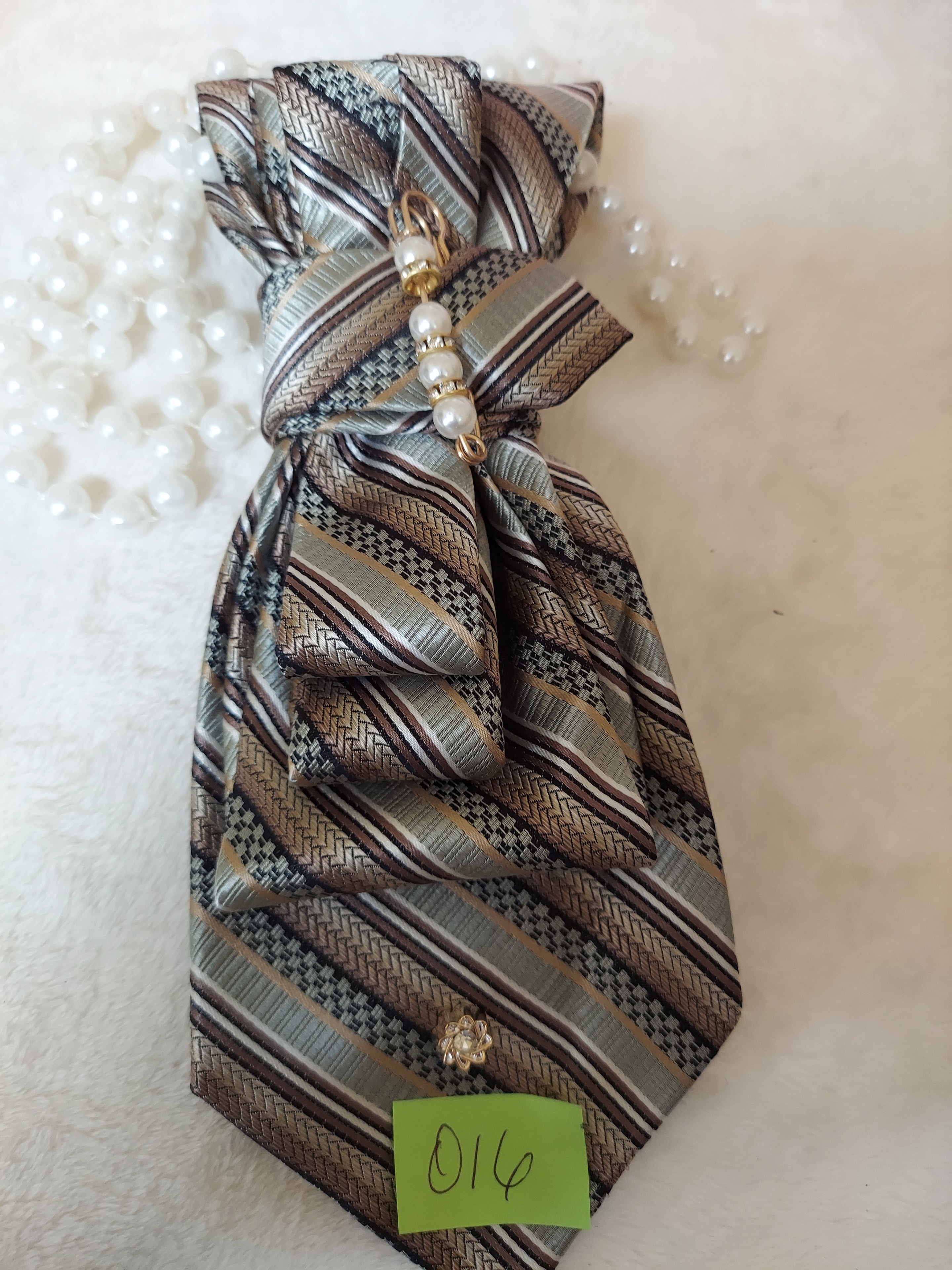 Earth tone striped necktie with pearl bead embellishments